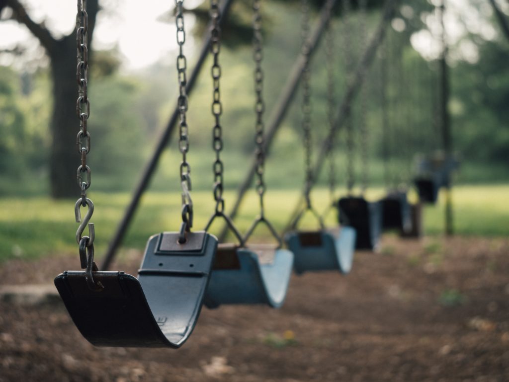 row of empty swings