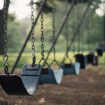 row of empty swings